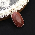 Ovale roodbruine zandsteen hanger met gouden glitters en een goudkleurige rand - 13x25mm, 3g / Goudzandsteen