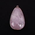 Macro view of a faceted pear-shaped rose quartz pendant with rose gold plated edging - 31x55mm (1008-T250407011) / Rose Quartz