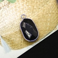 Oval faceted black stone pendant with silver plated edge and small hanging loop - Black Agate