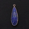 Macro detail of faceted teardrop lapis lazuli pendant with elegant gold plated rim - 11x41mm / Lapis Lazuli