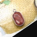 Rectangular goldstone pendant with silver plating and shimmering brown texture - Gold Sandstone