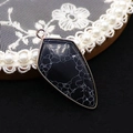 Shield shaped spotted stone pendant with rose gold metal frame on black background - Pendant Only (No Chain) / Black Line Howlite