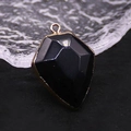 Polished black faceted geometric shield pendant with elegant gold plated metal edging - Black Agate