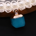 Macro shot of deep blue hexagonal cut stone pendant with polished gold metal cap and loop - 10x15mm / Blue (No. 1)