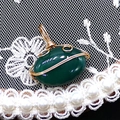 Macro detail of oval green striped agate pendant with golden hand-wrapped wire craftsmanship - 14x21mm (3g) / Green Agate (No.3)