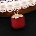 Detail view of a hexagonal red faceted gemstone pendant with a gold cap and pearl lace choker - 10x15mm / Red (No. 4)