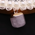 Detail shot of a purple translucent stone pendant with a gold clasp on a white lace choker - 10x15mm / Rose Quartz