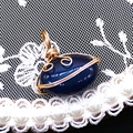 Detail of handmade gold wire-wrapped oval striped agate pendant on vintage lace background - 14x21mm (3g) / Dark Blue Black Stone (No. 4)