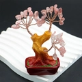 Macro detail of pink crystal money tree with copper wire branches and flower pot - Watermelon Quartz