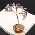 Detail of handmade gemstone tree with copper wire branches and natural amethyst leaves - Purple Fluorite