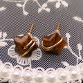 Star-shaped tiger eye stone stud earrings with elegant gold wire wrapping detail - Tiger's Eye