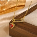 Golden safety pin necklace with a red heart-shaped gemstone and cubic zirconia - Red Style (NC-1650GR)