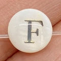 Flat round white mother of pearl bead with golden letter F and natural shell luster - 6mm / Style F
