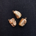 Three pieces of irregular lava-textured gold pendants with rings for DIY jewelry - Brown