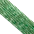 Vue macro de perles cylindriques en pierre naturelle verte pour la création de bijoux DIY - 4x4mm / N°17 Aventurine