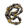 Polished tiger eye gemstone necklace with cylindrical beads and metal clasp closure - Tiger's Eye