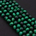 Macro shot of polished green cat eye stone beads with silky luster for jewelry making - Dark Green (No.8)
