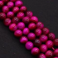 Macro shot of 8mm rose red tiger eye stone beads with cat eye effect for DIY jewelry - Rose Red (No.7)
