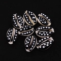 Close-up of natural cowrie shells with black base and white polka dot pattern for DIY jewelry - No. 7 (20 Pieces/pack) / 9x19mm,1.5g