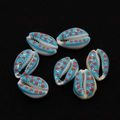 Macro detail of hand-painted blue and orange polka dot natural cowrie shell pendants - No. 4 (20 Pieces/pack) / 9x19mm,1.5g