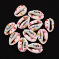 Macro shot of natural seashell beads with hope lettering and floral patterns for DIY jewelry - Pack of 20 (9x19mm) / Hope Pattern (No. 4)