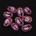 Macro shot of colorful painted cowrie shell beads with geometric floral patterns for DIY jewelry - Multicolor Geometric Dot Style (No. 6)