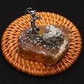 Macro shot of a creative miner figurine on amber crystal geode base with metallic ores - 55x55mm / Amber Stone Miner (Style 5)