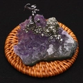 Macro shot of miniature miner figurine on natural amethyst cluster and pyrite base - 55x55mm / Amethyst Miner (Style 6)