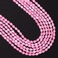Macro detail of faceted pink teardrop beads with cat eye effect for jewelry making - 4x6MM / Pink (No. 4)
