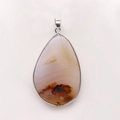 Macro shot of waterdrop teardrop agate pendant with silver electroplated metal edging - Silver Edging (No. 1) / US 1