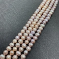 Lustrous AA-grade natural freshwater pearls in pink and champagne shades for DIY jewelry - 4-5mm / Purple