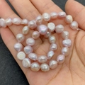 Strand of high-quality light lavender baroque freshwater pearls with natural luster - 4-5mm / Lavender
