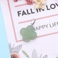 Green aventurine stone four-leaf flower pendant with silver bail on decorative card - Green Aventurine