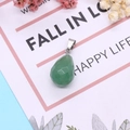 Faceted teardrop green natural stone pendant with silver bail on a decorative floral gift card - 13x23mm / Green Aventurine