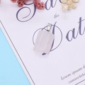 Semi-cylindrical rose quartz pendant with silver metal bail on artistic card - Rose Quartz
