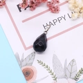 Faceted black natural stone teardrop pendant with silver clasp on floral gift card - 13x23mm / Black Agate