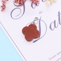 Red sandstone four-leaf flower pendant with silver bail and sparkling metallic finish - Gold Sandstone