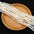 Irregular white seashell beads 4-6mm for DIY jewelry making displayed on a wooden tray - 4-6mm, 27g / White (No.5)
