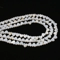 Natural heart-shaped white mother of pearl loose beads with iridescent shell luster - Horizontal Hole Heart Shape