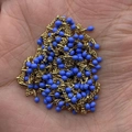 Golden fine chain necklace featuring blue oil-drop teardrop charms for jewelry DIY - In Roll / Blue