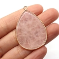Pink quartz teardrop pendant with gold edge and natural stone texture details - Rose Quartz