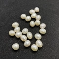 Natural white freshwater rice pearls on black textured background for jewelry DIY - 3-4mm / White