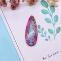 Macro shot of teardrop imperial stone pendant with vibrant pink and blue natural texture - 16x42mm 9g / US 9