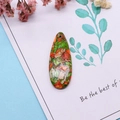 Macro view of teardrop natural emperor stone pendant with colorful textured marble pattern - 16x42mm 9g / US 6