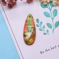 Detailed view of teardrop natural stone pendant with colorful landscape patterns for DIY jewelry - 16x42mm 9g / US 12