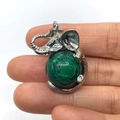 Silver elephant pendant with a round green striped malachite stone held in hand - 21x32mm / Malachite