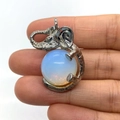 Silver elephant pendant with large opal stone inlay, held by hand for scale - 21x32mm / Opal