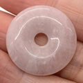 Polished natural rose quartz donut pendant with translucent pink tones and ring shape - Rose Quartz