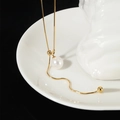 Elegante verstellbare Schlangenkette mit Perlenanhänger und Goldquaste für Damen - Ziehbare Perlen-Pulloverkette / Gold