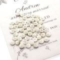 Detailed view of white shell beads with golden sun pattern engraving on elegant card - Sunflower / 6mm 20g 20 Pcs/Pack